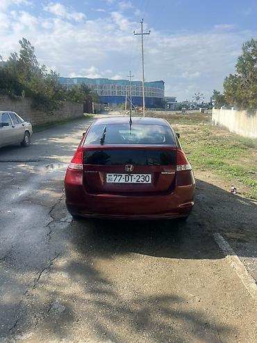 sador disk: Honda Insight – hibrid hetçbek - Rəng: tünd qırmızı/metalik - Kuzov — 2