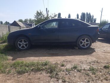 машина сатып алуу: Автомобиль Mazda 323F в кузове хэтчбек. Модель выделяется своим