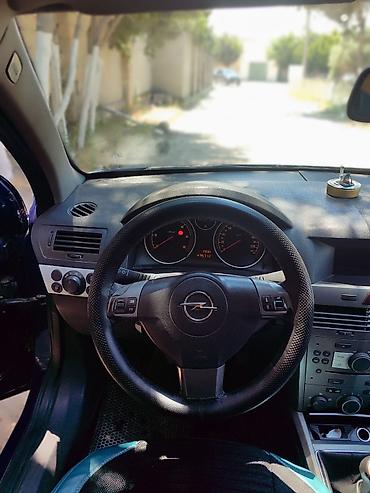 uşaq ucun avtomobil: Opel Astra H Caravan (universal), tünd mavi rəng. - Korpus: 5 qapılı — 7