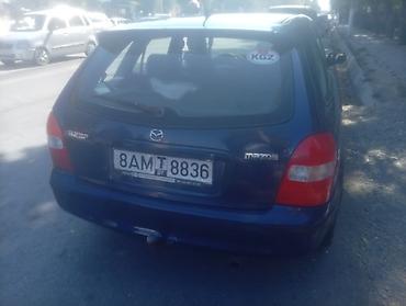 аудио касета: Mazda 323: 2000 г., Механика, Бензин — 3