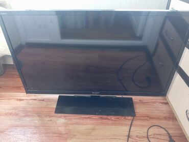 купить монитор изогнутый: Телевизор LG в черном корпусе. Модель оснащена выпуклым экраном и