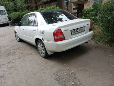 авто крепеж: Mazda 323: 2001 г., 1.5 л, Автомат, Бензин, Седан