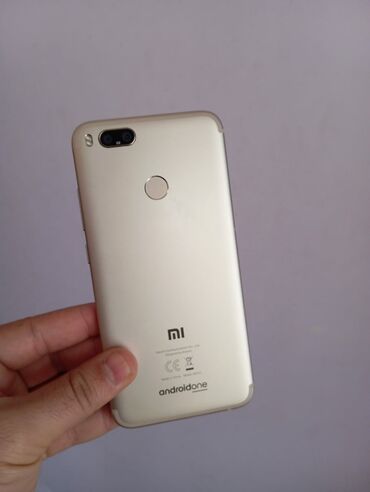 Мобильные телефоны: Xiaomi Mi A1, 64 ГБ, цвет - Золотой, 
 Кнопочный, Отпечаток пальца, Две SIM карты