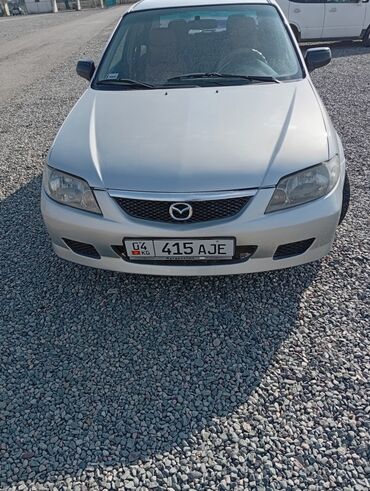 Mazda: Mazda 323: 2002 г., 1.6 л, Механика, Бензин, Седан