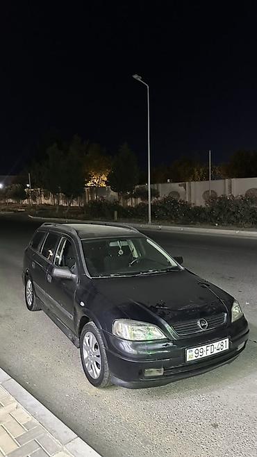 reno grand senik: Opel Astra Caravan (universal kuzov) - Geniş salon və iri baqaj: arxa — 10