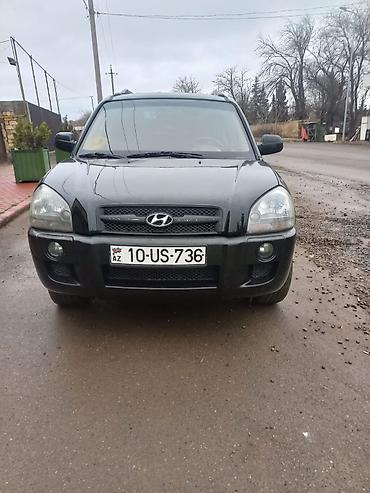 l200 disk: Hyundai Tucson, qara rəng, şəhər və uzun yol üçün rahat SUV. Texniki — 3