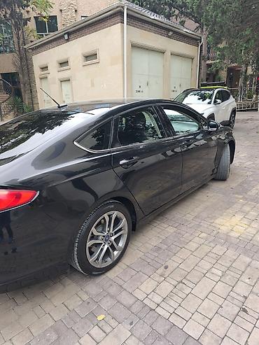 disk maşın: Ford Fusion sedan – qara rəng, modern və aerodinamik dizayn. 2017 — 7