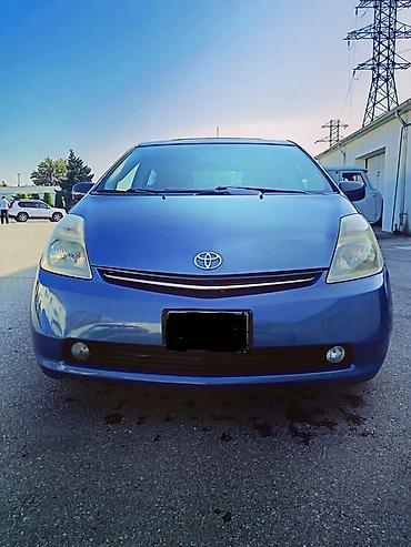 masini hibrid ieftine: Toyota Prius (2-ci nəsil, liftback), mavi rəng. - Hibrid güc qurğusu — 2