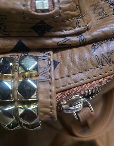 Modni rančevi: MCM mini stark ranac konjak braon boje sa monogram printom. Nov je — 4