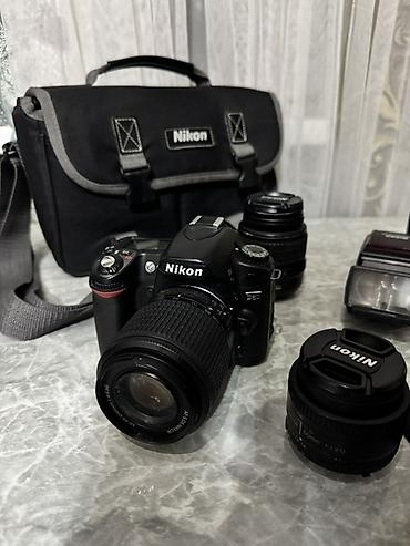 Фотоаппараты: Зеркальный фотоаппарат Nikon с комплектом оптики и аксессуаров — 1