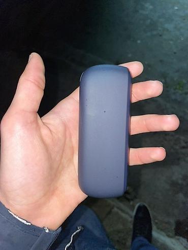 IQOS elektron qızdırılan tütün cihazı, qapaqlı kompakt korpusla təqdim