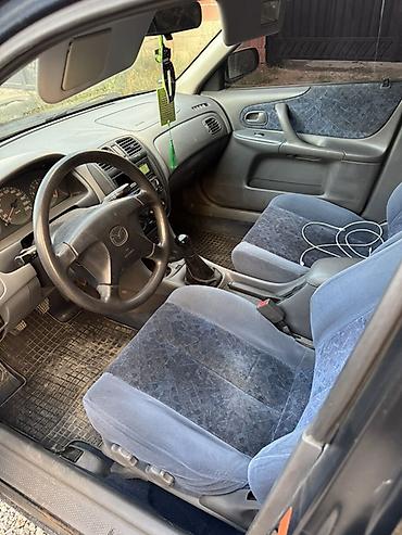 Унаа сатуу: Mazda 323: 1999 г., 1.6 л, Кол менен иштөөчү, Бензин, Седан — 10