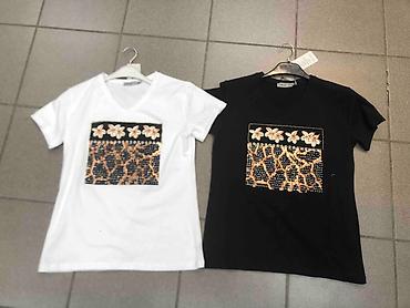 Majice kratkih rukava: Majice 
S M L 
Cena 2000 din — 19