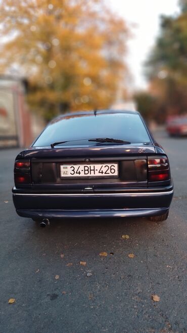 Opel: Opel Vectra A liftback (5 qapı), tünd mavi rəng. Texniki — 4