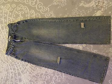 cırıq şalvar: Şalvar – geniş kəsimli, açıq mavi (stonewash) denim - Model — 1