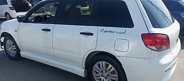 opel corsa b: Mitsubishi Airtrek (ağ rəng, universial kuzov. Maşının Matoru — 2