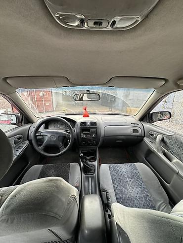 bmw e32: Mazda 323: 1998 г., 1.5 л, Механика, Бензин, Хэтчбэк — 5