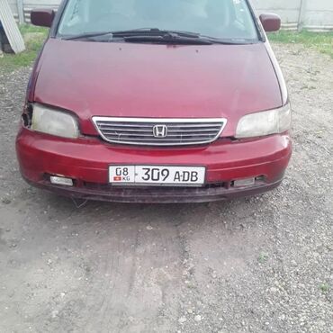 хонда одиссей сиденья: Минивэн Honda Odyssey красного цвета с характерным дизайном кузова