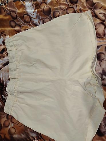 idman şort: Acıq sarı rəng şort (skort) - Model: Şort kimi rahat, etek görünüşlü — 1