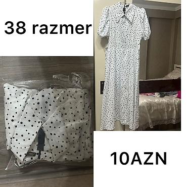 duyməli: Ağ rəngli, xırda qara xallı qadın paltarı. Dizdən aşağı uzunluq, qısa — 1