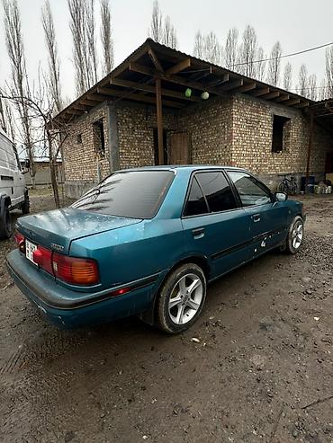 Mazda 323: 1994 г., 1.8 л, Механика, Бензин, Седан — 1
