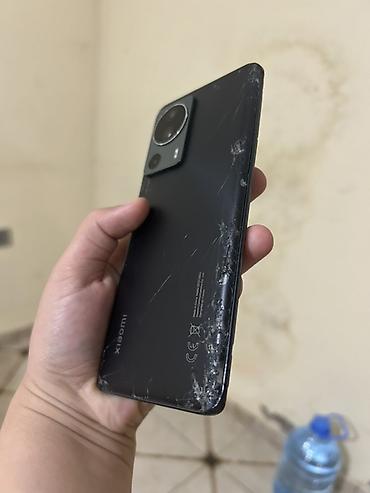 Мобильные телефоны: Xiaomi 12 Lite, 128 ГБ, цвет - Черный, 
 Битый — 7