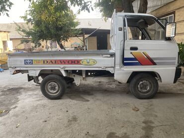 срочно продаю в связи с переездом: Белый грузовой пикап Daewoo Labo предназначен для перевозки небольших