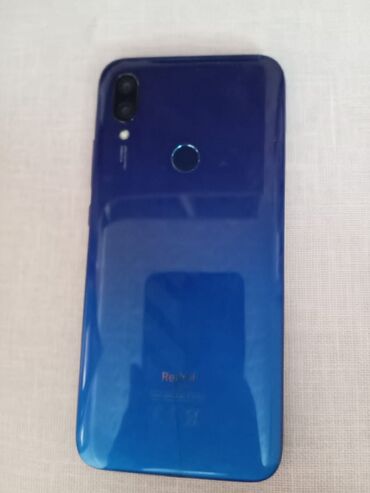 telefon not 11: Xiaomi Redmi 7, 32 ГБ, цвет - Синий, 
 Отпечаток пальца, Две SIM карты