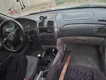 мтз 92 п: Mazda 323: 2002 г., 1.6 л, Механика, Бензин, Универсал — 2