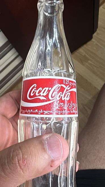 Məhsul: Şüşə Coca‑Cola butulkası Təsvir: - Həcm: 0.25 L (etiketdə