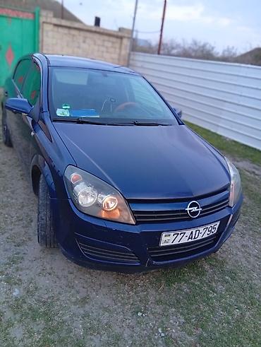 Opel: Opel Astra H, göy rəng, heçbek kuzov. Texniki xüsusiyyətlər: - Ön — 3