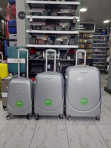 Çamadanlar: Gümüş rəngdə sərt korpuslu çamadan dəsti – 3 ölçü - 3-lü set: kiçik — 1