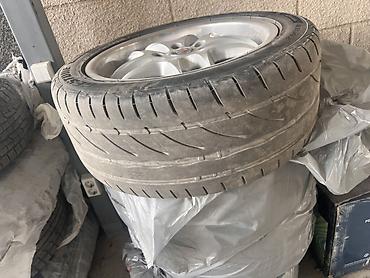 Колесо в сборе: летняя шина Bridgestone Potenza RE002 на легкосплавном