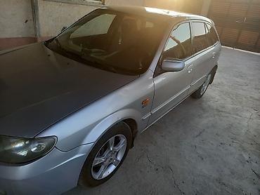 mcv 21: Mazda Familia: 2002 г., 1.6 л, Механика, Бензин, Седан — 1