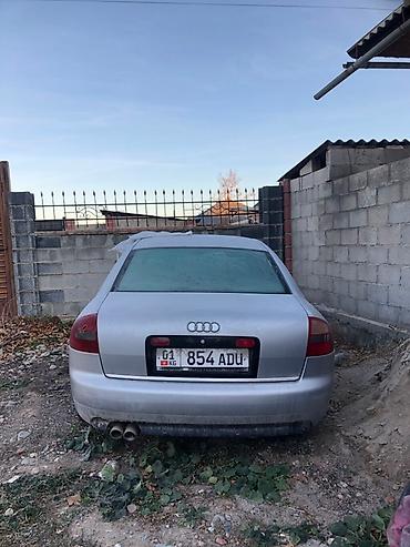 Audi A6 C5 седан, серебристый, левый руль. Номерные знаки KG