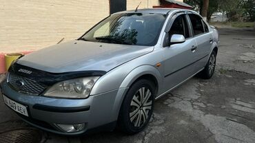 машина лизинг бишкек: Серебристый седан Ford Mondeo с характерным дизайном. Модель оснащена
