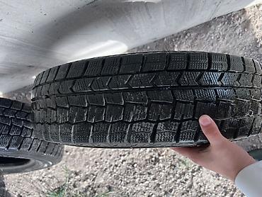 14 размер донголок: Комплект из 4 зимних шин Dunlop. Характеристики: - Размер: 185/70 R14 — 2