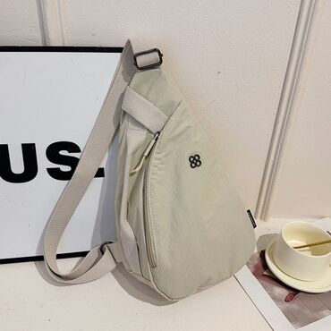 Другие сумки: Сумка-слинг через плечо, светло-бежевый цвет. - Формат — 1