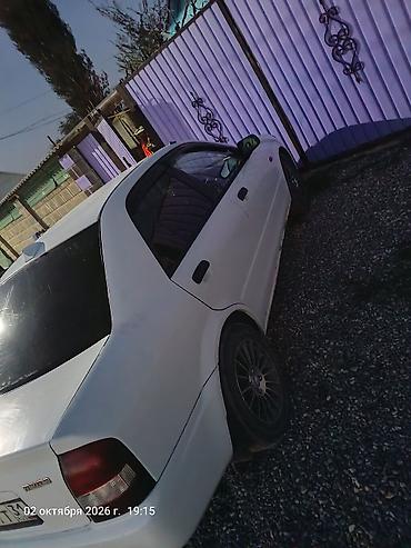 митсубиси цена: Mazda Familia: 2001 г., 1.3 л, Автомат, Бензин, Седан — 3
