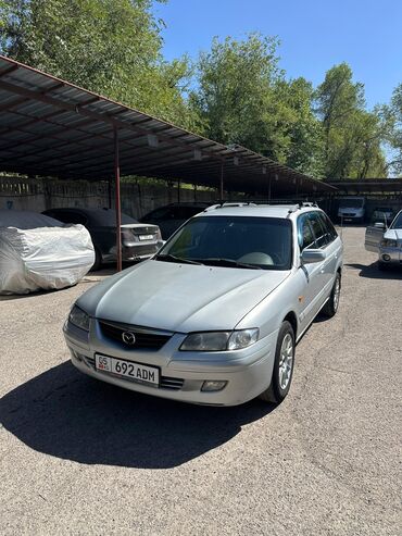 мерс е430: Автомобиль Mazda 626 в кузове универсал, окрашенный в серебристый