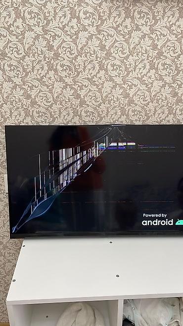 iphone cs max: Телевизор с Android TV (логотип Powered by Android на экране) — 1