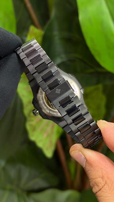 dirnaq modelleri adlari: Patek Philippe Nautilus tərzində lüks qol saatı – yaşıl daşlı bezel və — 8