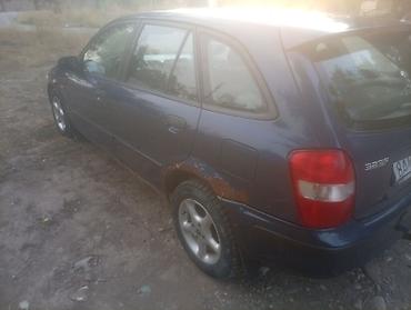 губа 211: Mazda 323: 2000 г., Механика, Бензин — 7