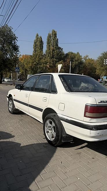 автомобильное зу: Mazda 626: 1990 г., 2 л, Механика, Бензин, Седан — 7