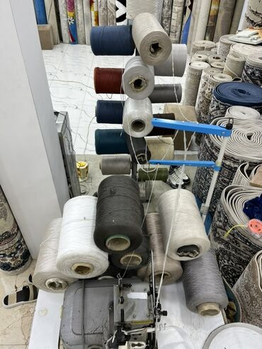 Digər istehsal avadanlığı: Xalça kənarı vurma (overlok) avadanlığı və iri həcimli sap bobinləri — 10