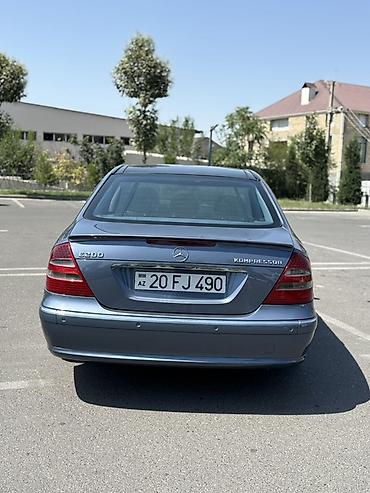 cls 63 amg: Mercedes-Benz E 200: 2 l | 2004 il Sedan — 6