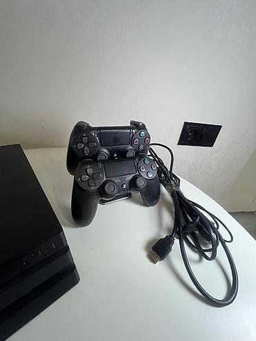 PS4 (Sony PlayStation 4): PlayStation 4 Pro (черный) Комплектация: - игровая консоль PS4 Pro — 6