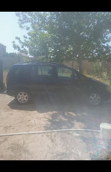 amg disk type 0: Opel Zafira, 1999 istehsalı – 7 yerlik ailə miniveni - Kuzov: qara — 1