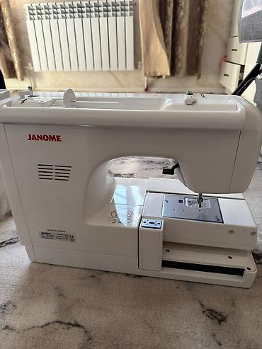кнопка: Вышивальная машина Janome Memory Craft 970E - Компьютеризированная — 2