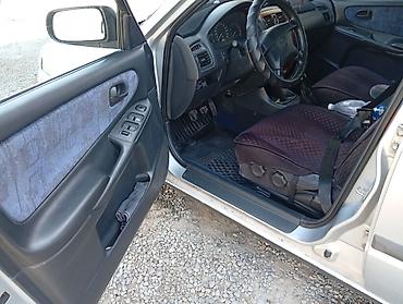 легкий карфакс: Mazda 626: 1998 г., 1.8 л, Механика, Бензин, Хэтчбэк — 6